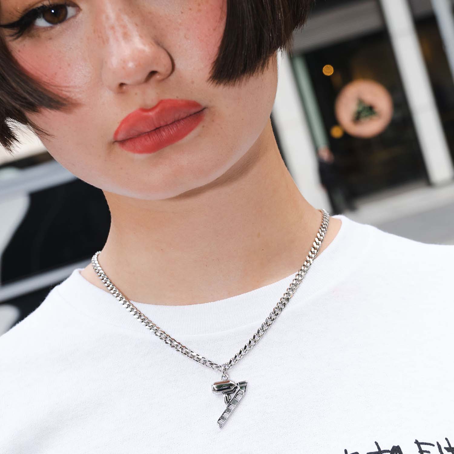 Personal Fears X American Psycho Nail Gun Necklace in Stainless Steel on model